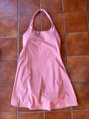 Halter-style athletic exercise dress featuring a built-in bra and shorts